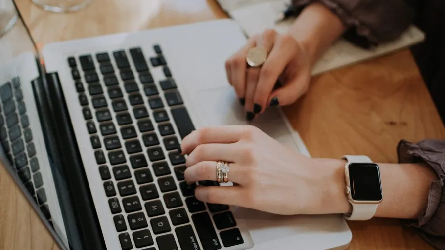 A small business owner working online on a laptop