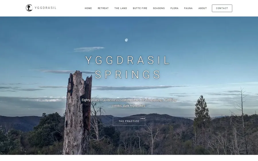 The finished Yggdrasil Springs home page with the site name in light, widely spaced capitals over a photograph of a dead tree and a daytime moon above the foothills
